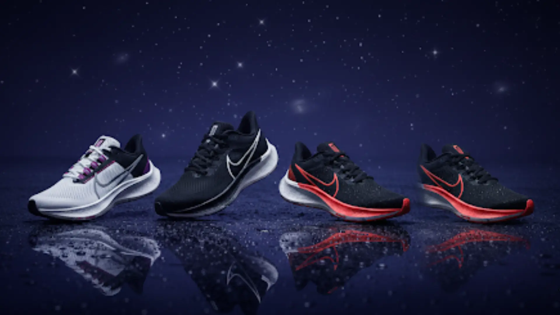Tenis deportivos modernos en blanco, negro y rojo sobre superficie mojada con reflejos y estrellas.